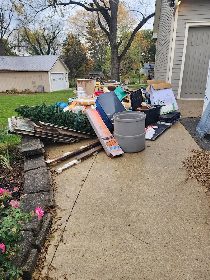 Dumpster being loaded with debris for 30 Yard Dumpster Rental in Macedon